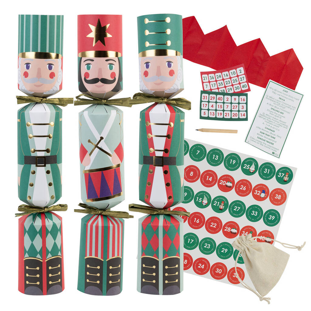 Set of Christmas cracker boxes with Nutcracker design, advent calendar, and other items on a white background.