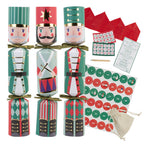 Set of Christmas cracker boxes with Nutcracker design, advent calendar, and other items on a white background.