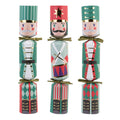 Set of four colorful nutcracker crackers on a white background